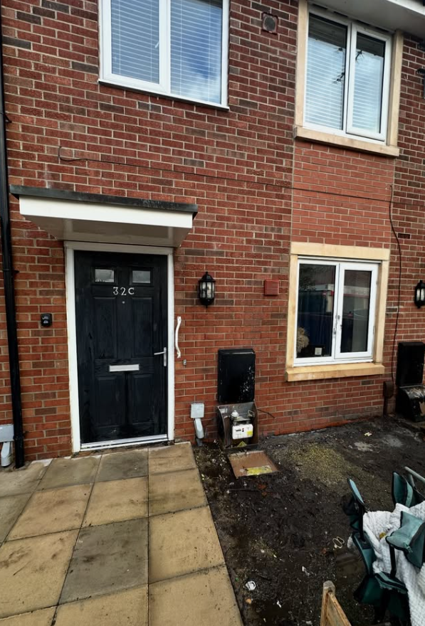 Clean brick house front after successful professional graffiti removal in Liverpool