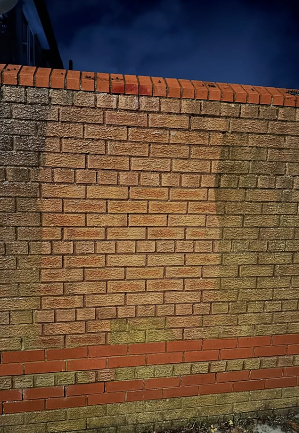 Restored brick wall showing original warm red tones after cleaning