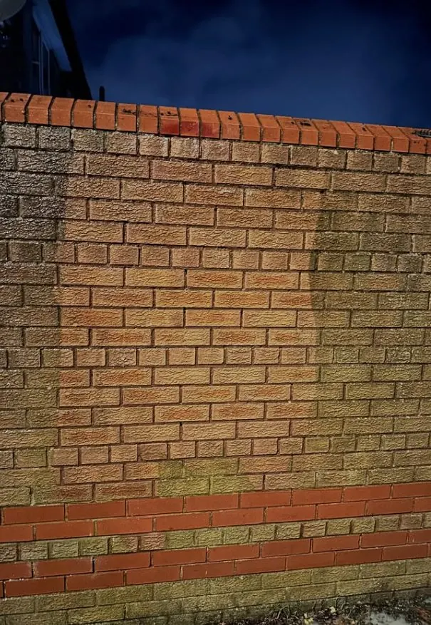 Restored brick wall showing original warm red tones after cleaning