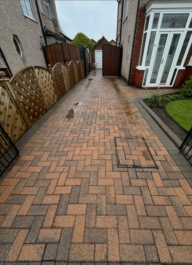 Clean herringbone block paving driveway after pressure washing