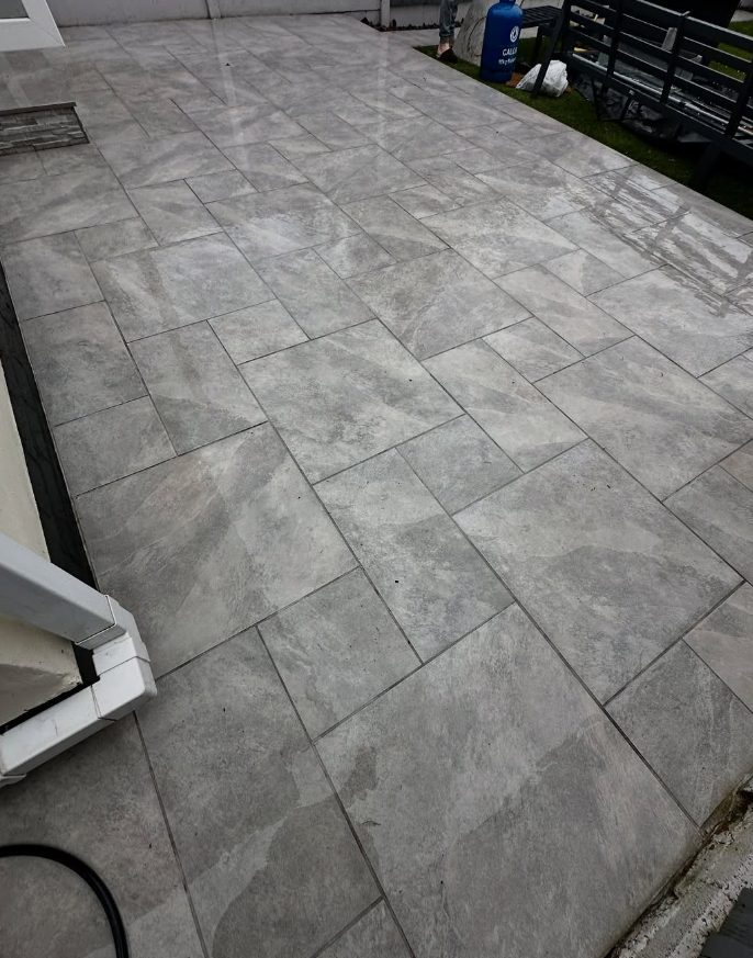 Grey flagstone patio cleaned to original condition using steam jet washing