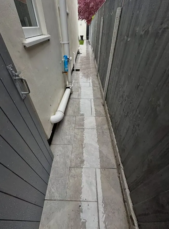 Narrow side passage paving after pressure washing and patio cleaning