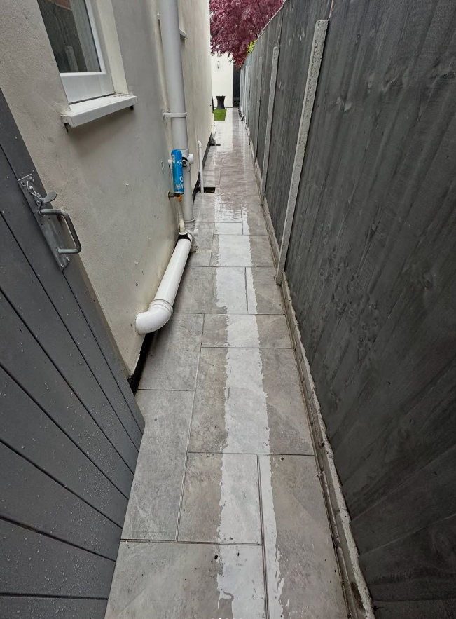 Narrow side passage paving after pressure washing and patio cleaning