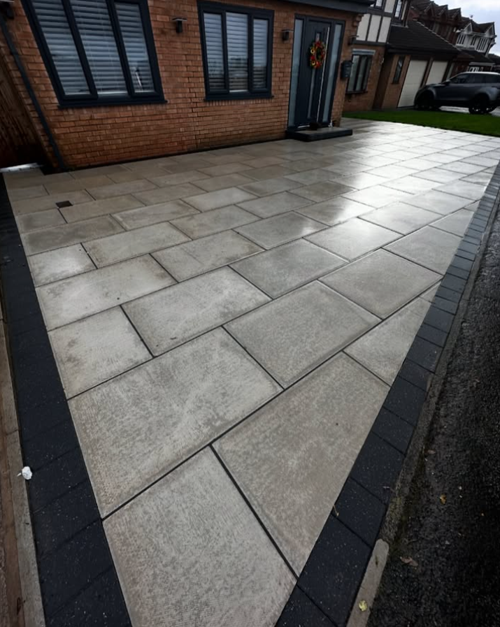 Clean grey patio slabs after professional steam cleaning