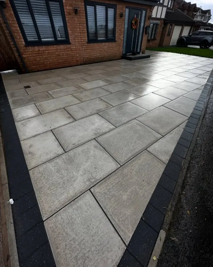 Clean grey patio slabs after professional steam cleaning
