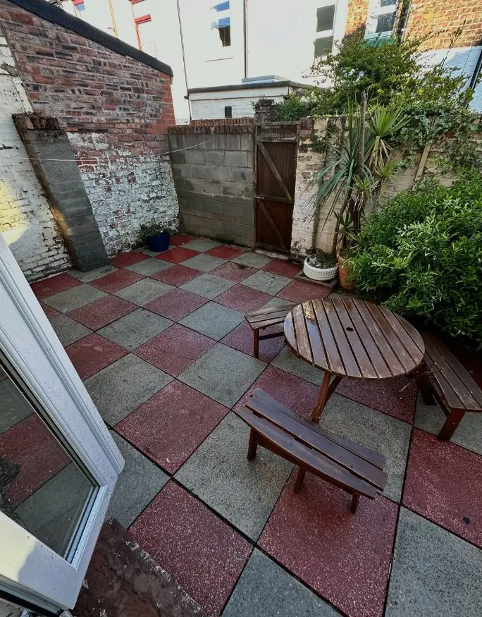 Small courtyard patio after pressure washing and exterior surface cleaning