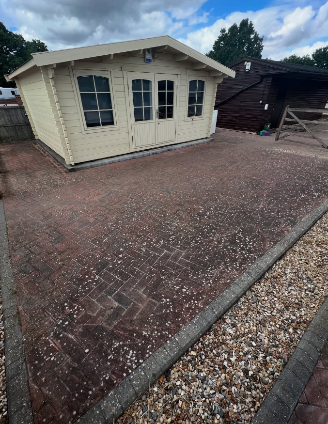 Block paved area around a garden room before driveway cleaning
