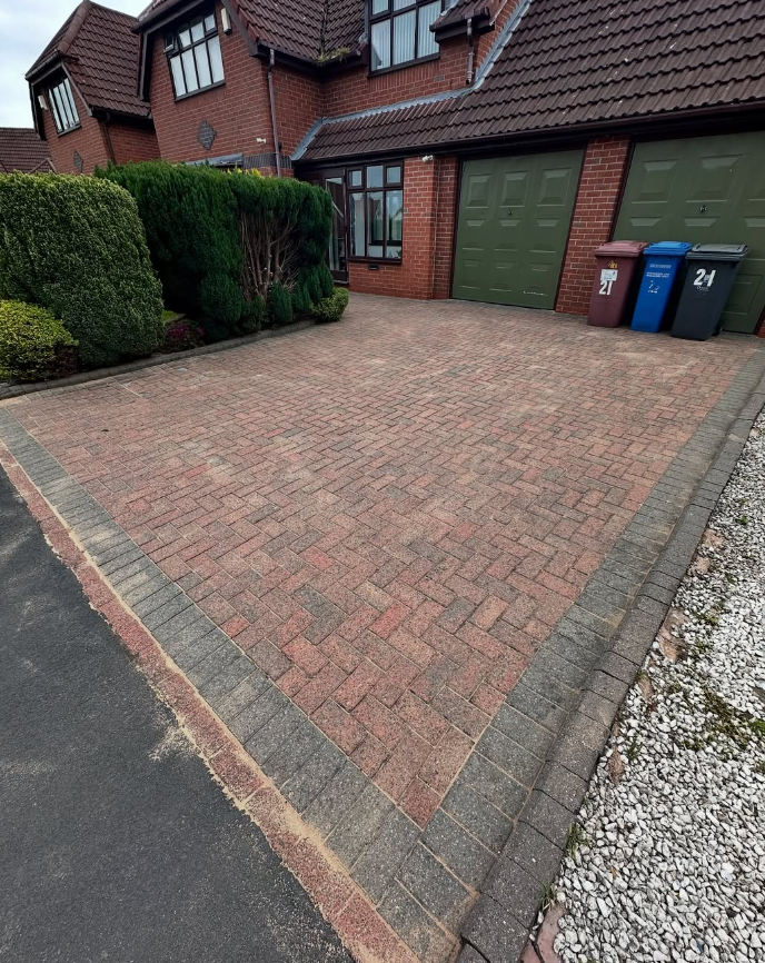 Large residential block paved driveway before cleaning and re-sanding