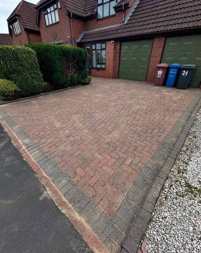 Large residential block paved driveway before cleaning and re-sanding