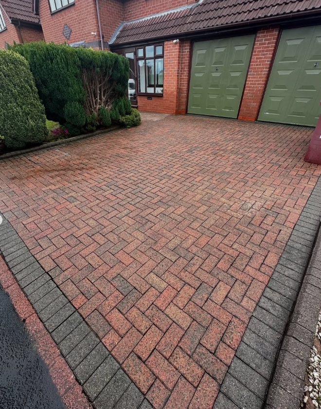Large herringbone block paved driveway fully restored after cleaning